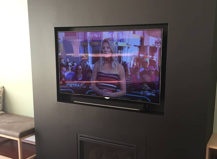 TV-Sounbar-insalled-over-fireplace