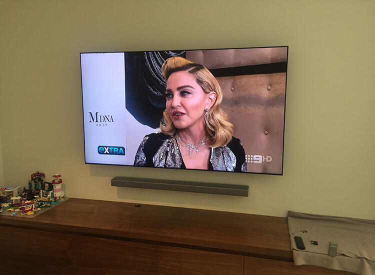 TV mounted on external with cables hidden in wall