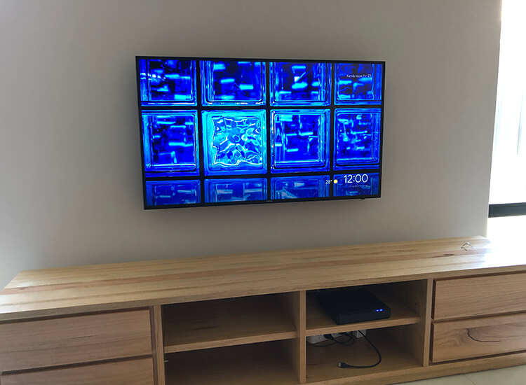 TV mounted on external with cables hidden in wall
