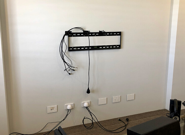 TV bracket with cables hidden in wall
