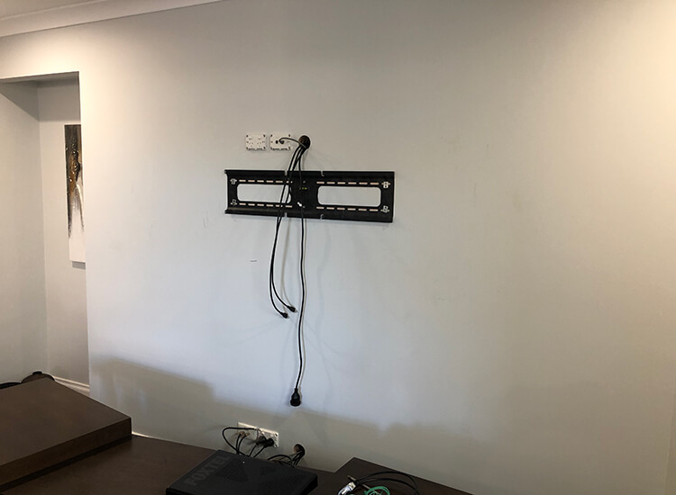TV bracket with cables hidden in wall