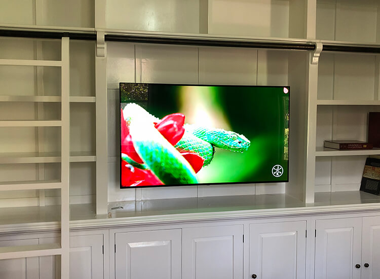TV wall mounted in cabinetry