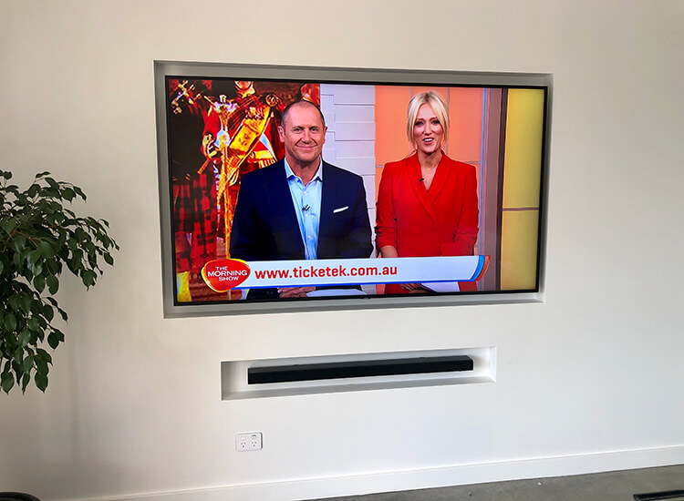 TV wall mounted on a feature wall