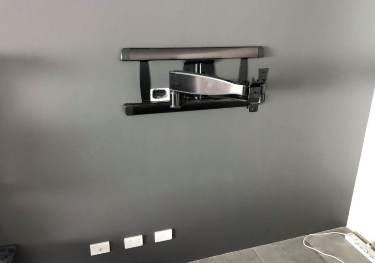 The full motion Sanus TV bracket looks great and provides excellent swivel and tilt.