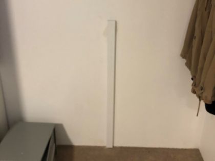 TV cable is hidden on opposite side of the wall that TV is mounted on.