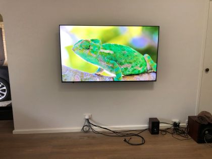 Almost finished mounting a TV using cable punch through technique.