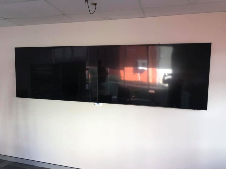 two 75" samsung tvs wall mounted side by side