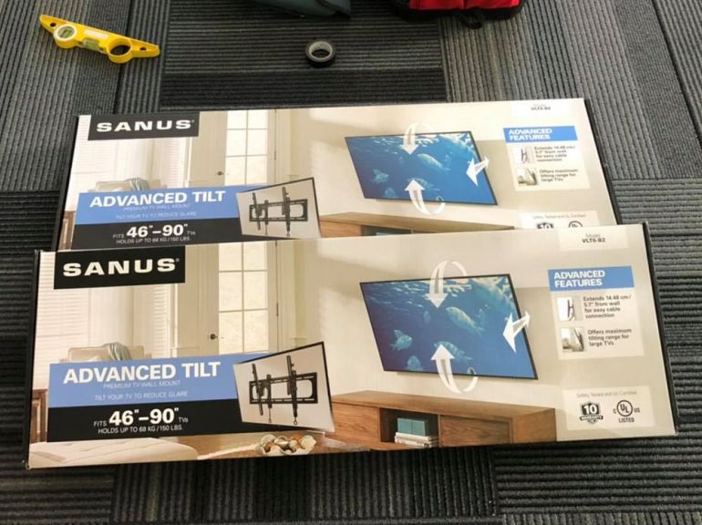 Two Sanus Advanced Tilt TV brackets in their boxes.