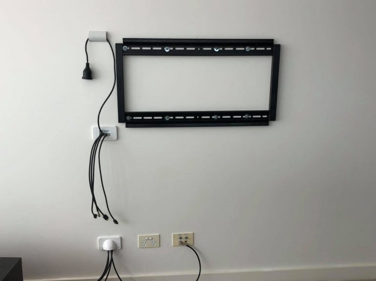 mounting bracket fixed to the wall prior to hanging the TV