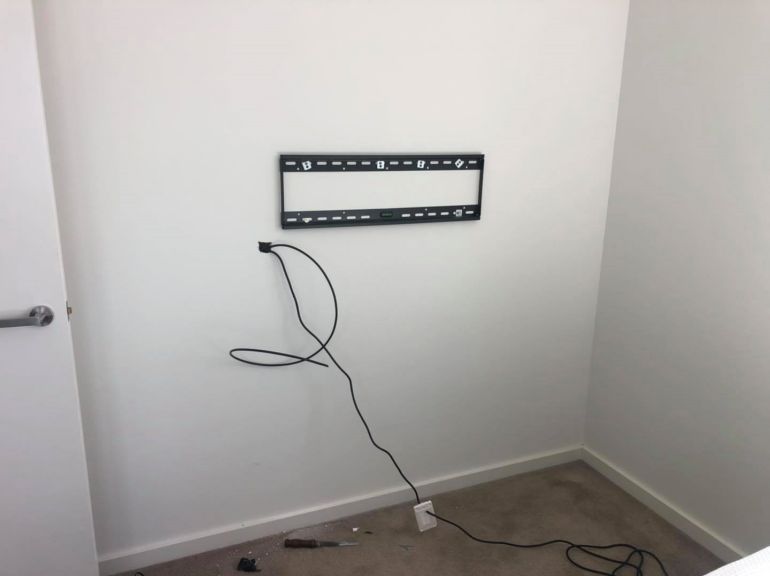 tv bracket mounted on gyprock cavity wall in cockburn apartment