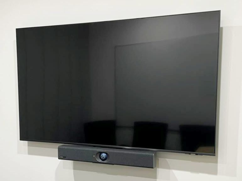 Wall mounted 55” Samsung TV with video soundbar