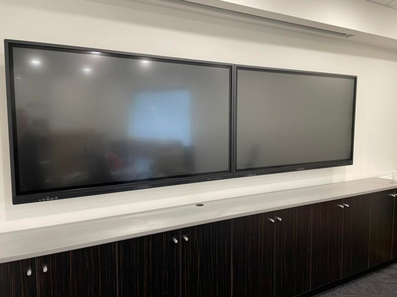 two wall mounted commbox interactive panels