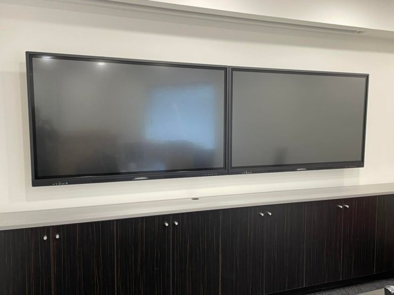 2 commbox screens wall mounted in a west perth office boardroom