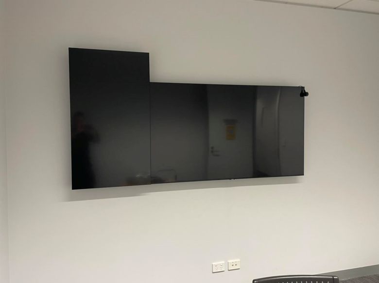LG portrait monitor mounted with a Samsung TV
