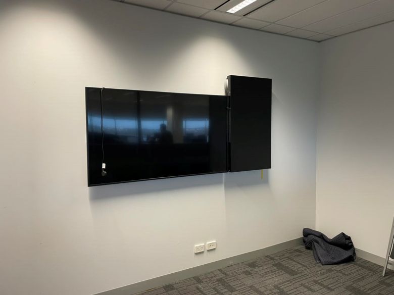 TV and portrait monitor fitted on a gyprock stud wall in osborne park office.