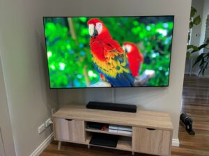 TV mounted on sanus super slim full motion bracket and tilted for better viewing from the side