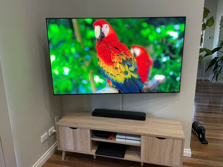 TV mounted on sanus super slim full motion bracket and swiveled for better viewing from the side