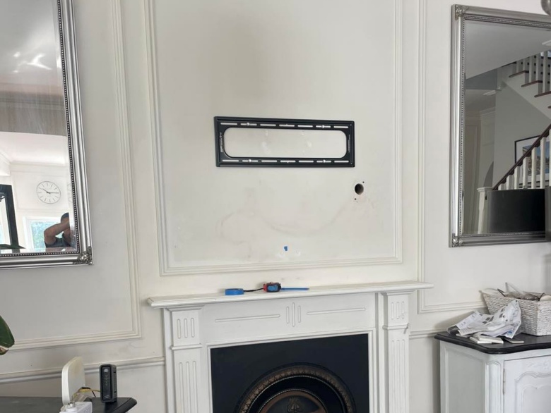 tv bracket installed above fireplace in west leederville