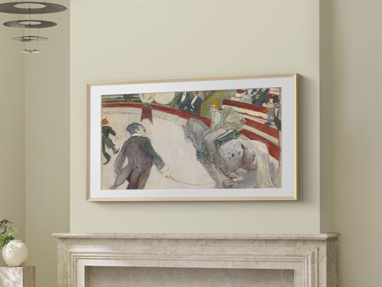 samsung the frame pro tv mounted above a fireplace